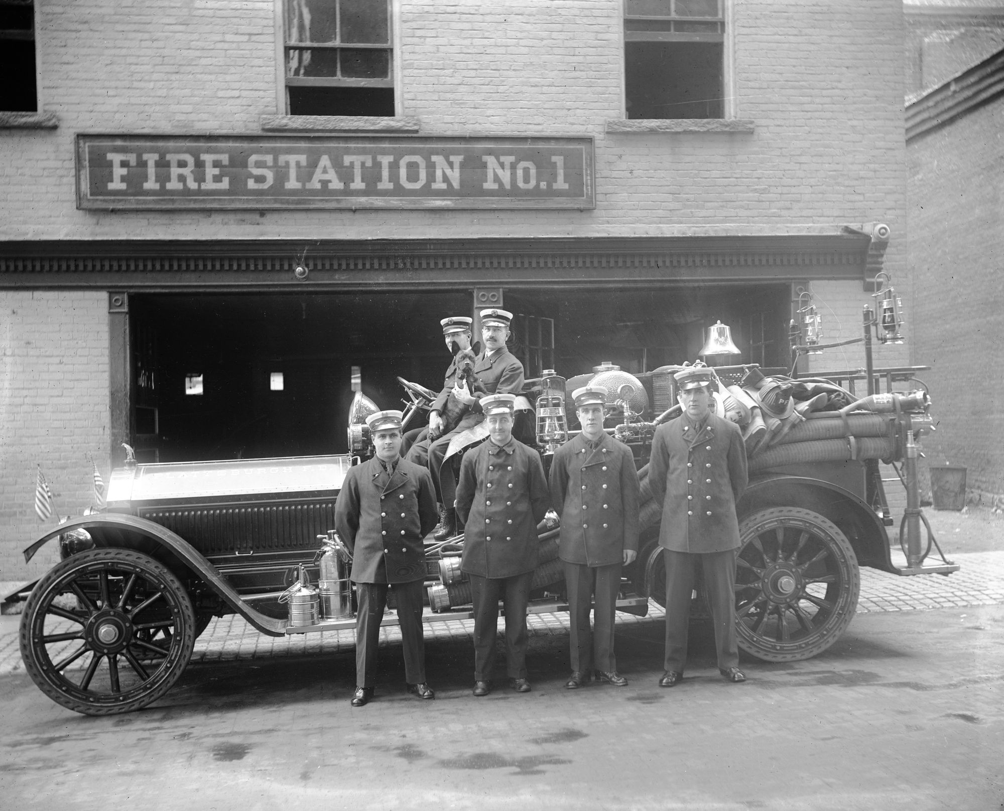 Firefighters in front of original fire department in Plattsburgh