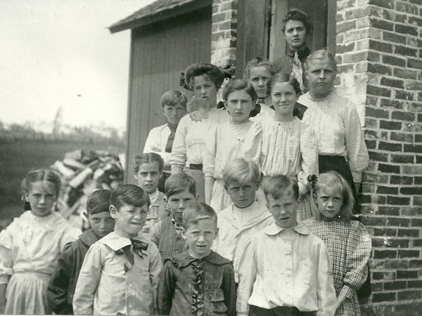 Teacher Hazel (Munson) Bixby with students in Norfolk