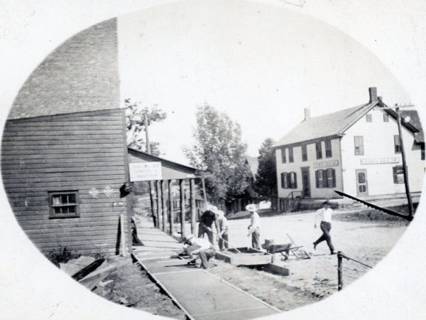 Laying sidewalk in front of Spaulding’s in Morley