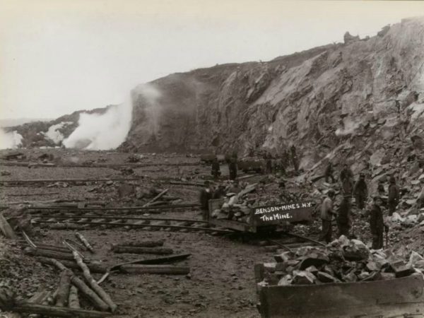 Ore cars being filed in the pit at Benson Mines