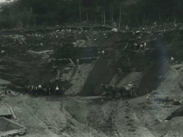 Miners in a gravel pit with teams of horses in Benson Mines