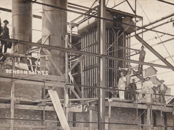 Workers on top of the Benson mine plant building framework. Circa 1910. Benson Mines, NY.