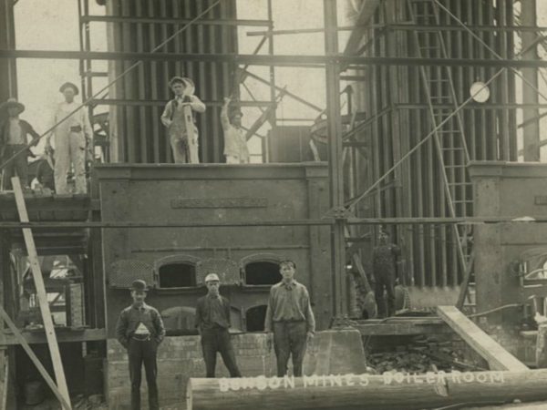 Workers outside the boiler room at Benson Mines