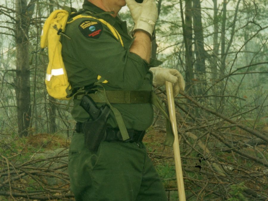 Forest ranger with Smokey the Bear at a campground in Cranberry Lake