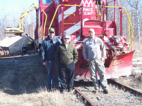 Rail yard crew loading wood chips at the Norfolk rail yard