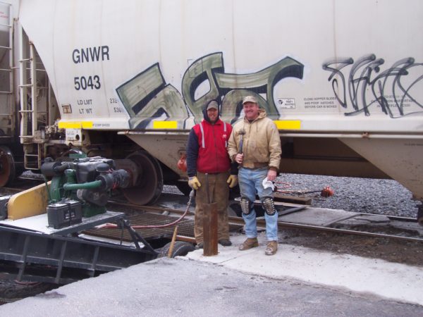 Unloading road salt from rail cars in Ogdensburg