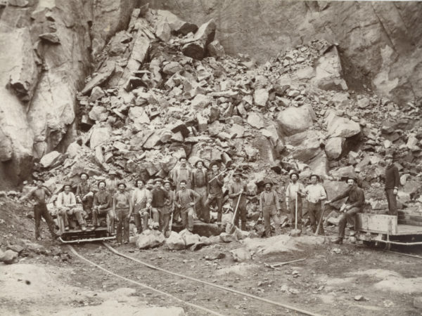 Miners with ore cars at Barton Mines in North River