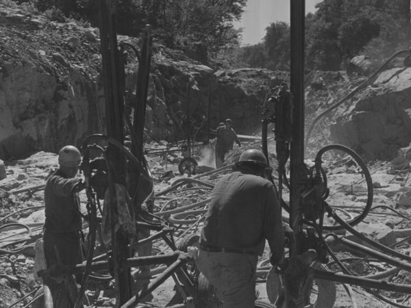 Men using machinery at Blake Falls in Parishville