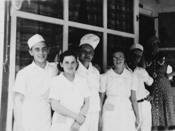 Employees in front of the Golden Anchor in Clayton