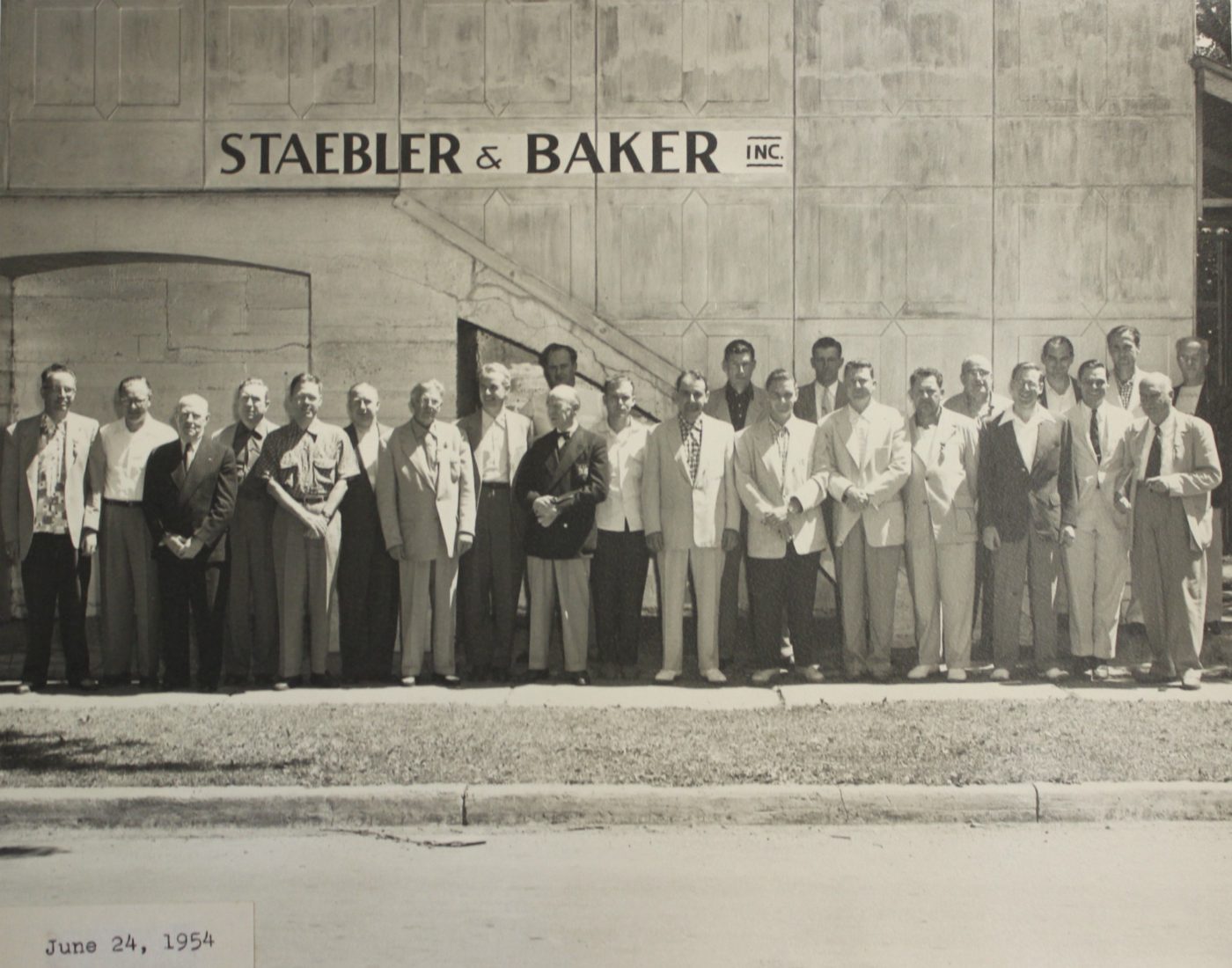 Workers outside Staebler and Baker in Clayton