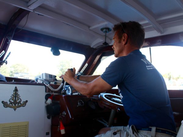 Fishing guide on his boat on the St. Lawrence River in Clayton