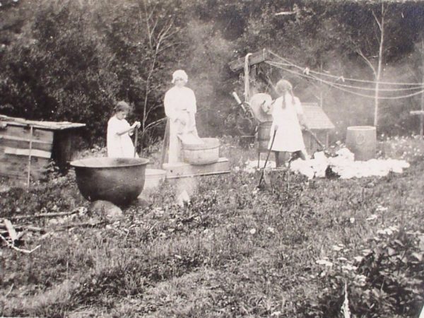 Three women washing clothes in Arietta