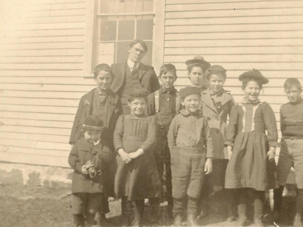 Teacher and students at District 3 School in Benson