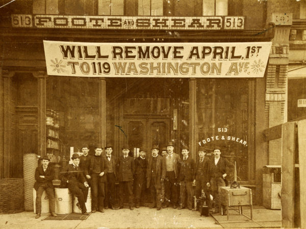 Men in front of Foote & Shear Hardware in Carthage