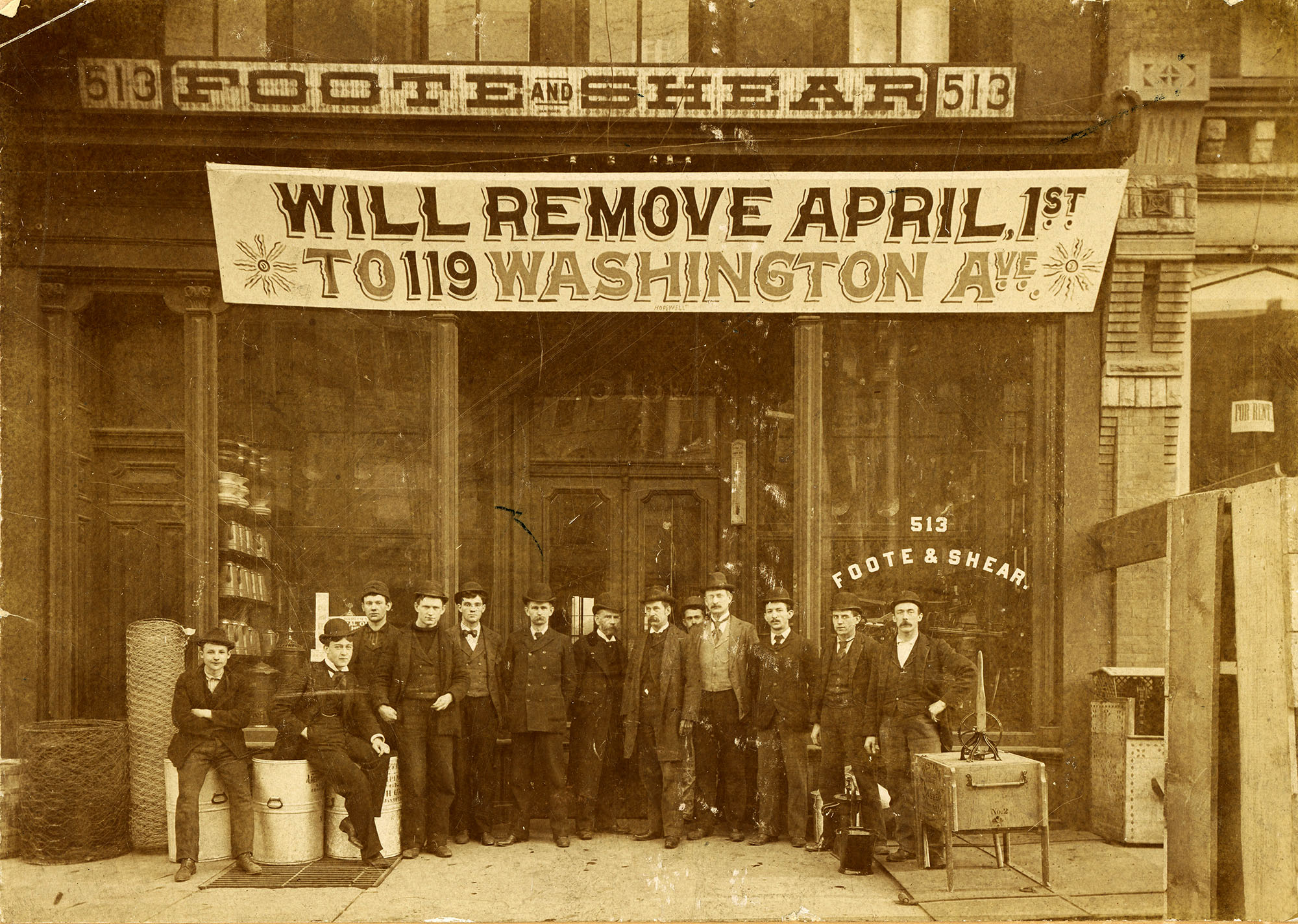 Men in front of Foote & Shear Hardware in Carthage