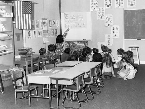 Teacher with students at New Carthage Elementary School.