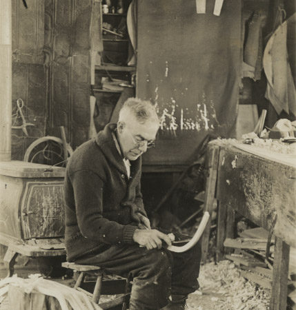 Wallace Emerson at work in his boat shop in Long Lake