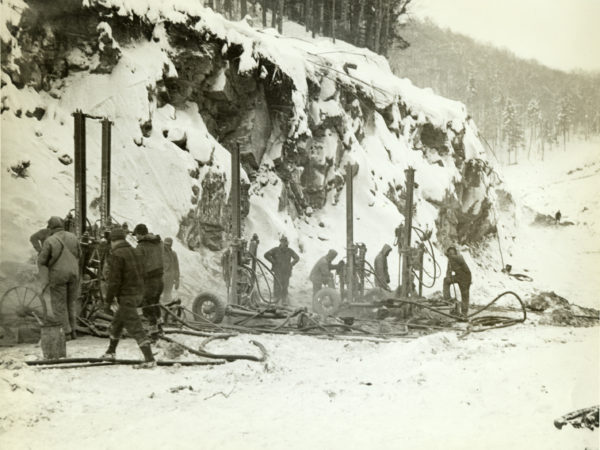 Men work with steam drills during winter in the Adirondacks