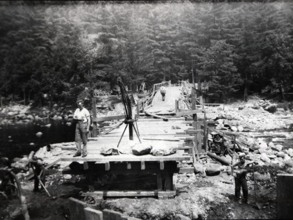 Civilian Conservation Corps workers build bridge in Speculator