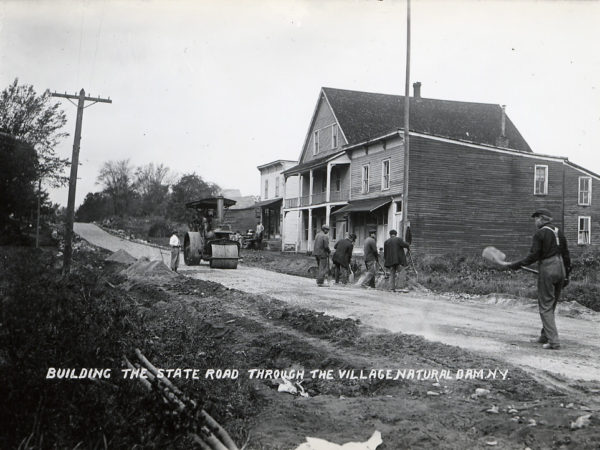 : Construction crew building the state road through Natural Dam