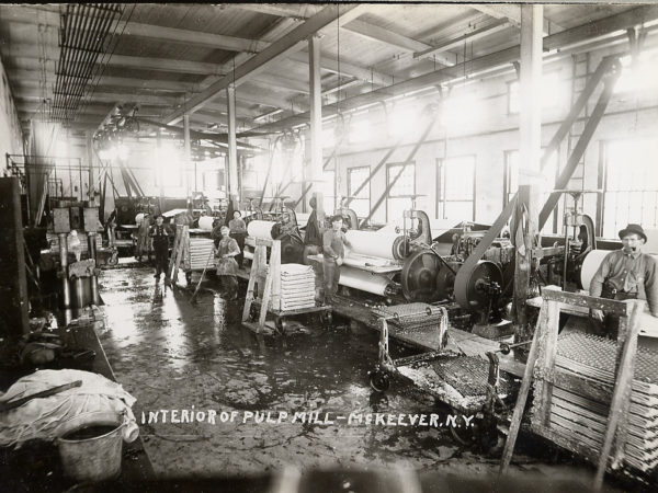 Men at work inside pulp mill in McKeever