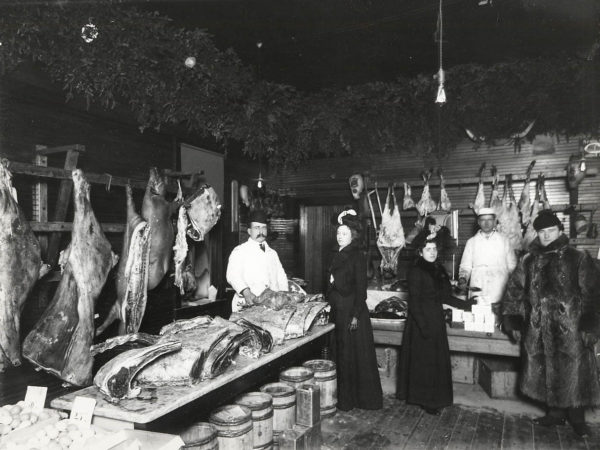 Women shop in a meat market in Saranac Lake