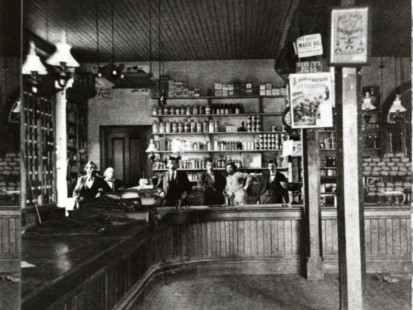 Men behind the counter of the Rogers Company Store in Au Sable Forks