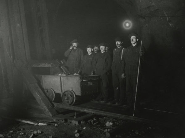 Miners with an ore car inside the Joker Mine in Mineville