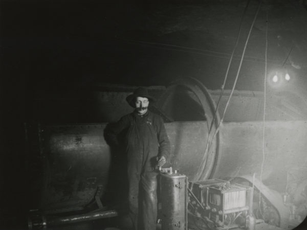 Man with ore car at the Republic Steel Corporation’s plant in Mineville