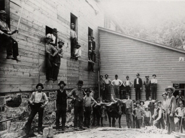 Men outside the graphite mill at Hoopers Mine in North River