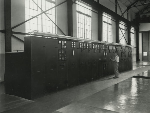 Cappy Weatherwax checking gauges inside Republic Steel Company power plant in Mineville