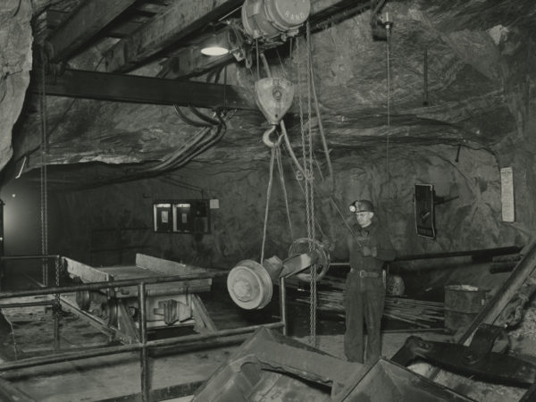 Worker moves ore car wheels in a Republic Steel Company mine in Mineville