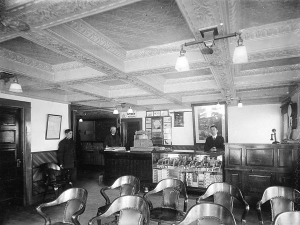 Three men inside the Hotel Chateaugay in Chateaugay