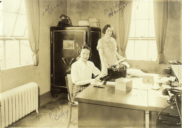 Elizabeth Albright and Mary Casey in office of Gladd Brothers Garage in Saranac Lake