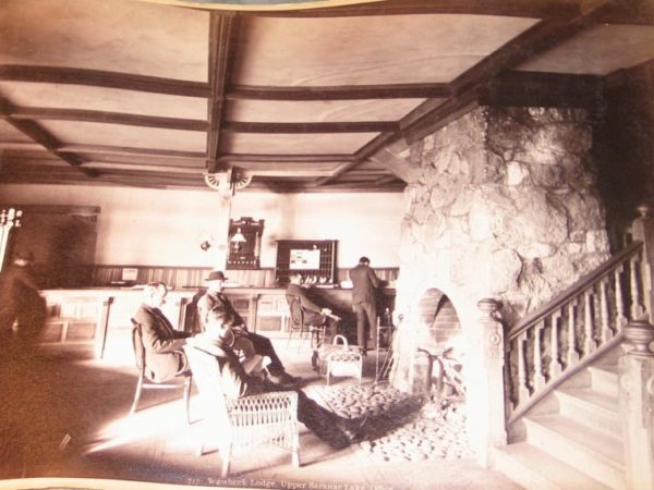 Men inside the lobby of the Wawbeek Lodge in Saranac Lake