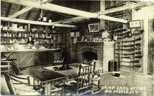 Man and woman inside the office of Camp Crag in Big Moose