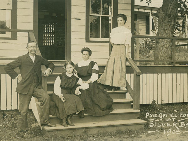 Workers on the steps of the post office in Silver Bay