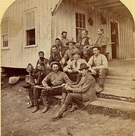 Guides on the steps of Martin’s hotel in Saranac Lake