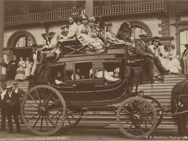 Women and men on top of stagecoach at the Fort William Henry Hotel in Lake George