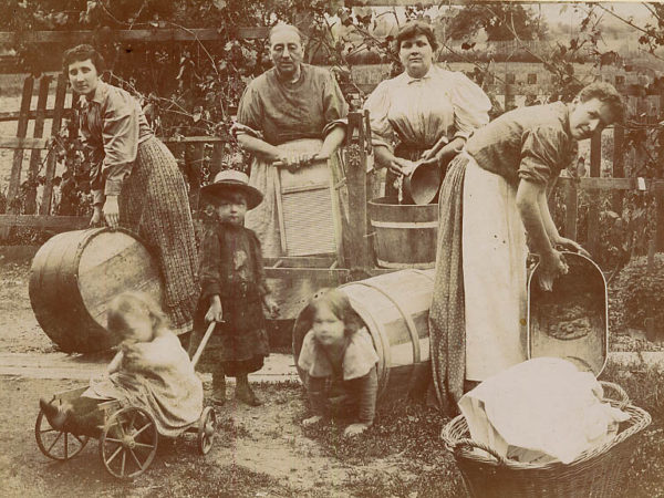 Women doing laundry in a yard in the Adirondacks