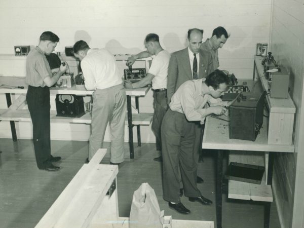 Trainees in the radio shop of the Signal Corps School in Paul Smtihs