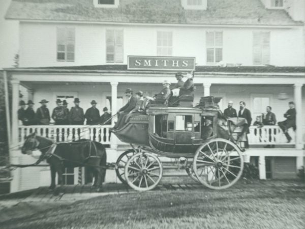 Stagecoach in front of Paul Smith’s Hotel in Paul Smiths