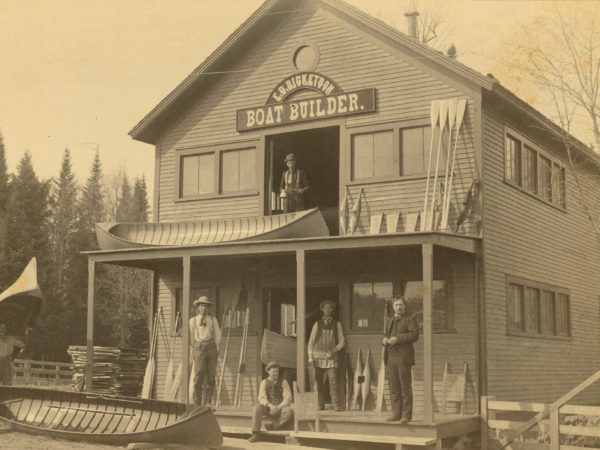 Men in front of the E.G. Ricketson Boat Building shop in Bloomingdale