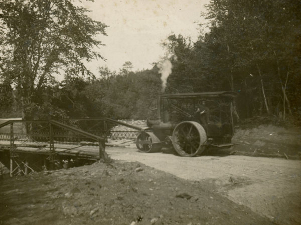 Operating a steam roller for railroad construction in Glens Falls