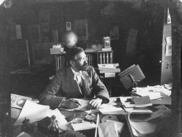 Seneca Ray Stoddard at his desk in Glens Falls