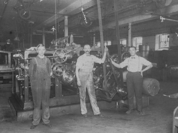 Three workers in the Morning Star print shop in Glens Falls