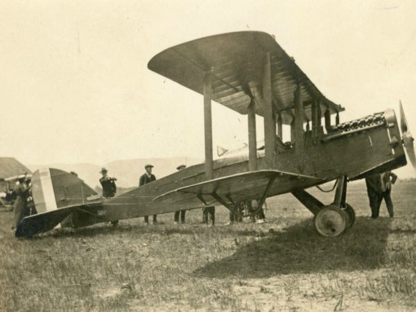 Examining a bi-plane at Aviation Filed in Glens Falls