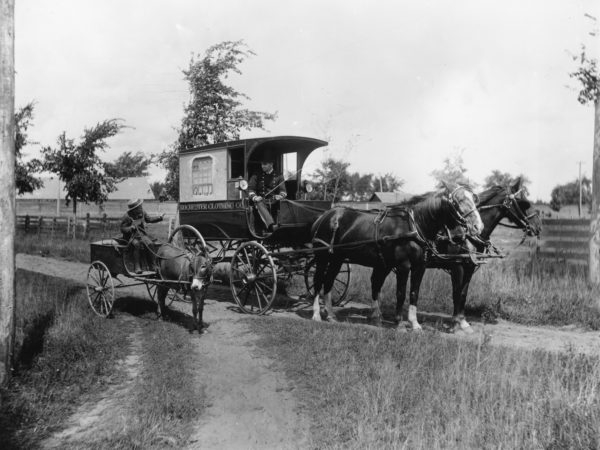 The Rochester Clothing Company delivery wagon near Glens Falls