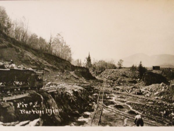 A miner at work in Pit #2 of Barton Mines in Ruby Mountain