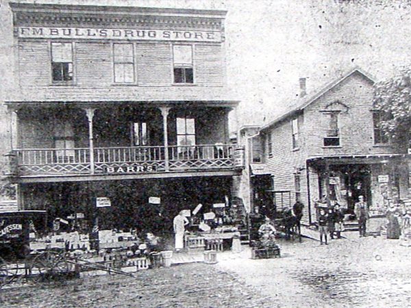 Barr’s Delicatessen Store and F.M. Bull’s Drug Store in downtown Saranac Lake